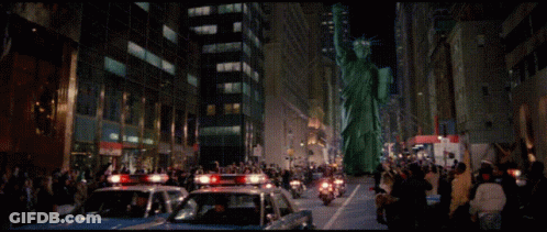 Crowd Behind Police Line Barrier GIF