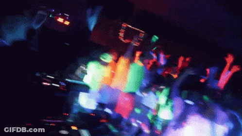 Crowd Dancing In Dark Room With Glow Lights GIF