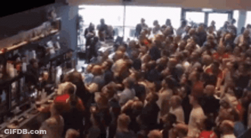 Crowd Gathered In Front Of Bar GIF