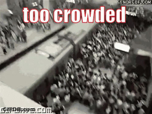 Crowd Gathered In Front Of Sign Reading Too Crowded GIF