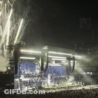 Crowd Gathered In Front Of Stage At Night GIF