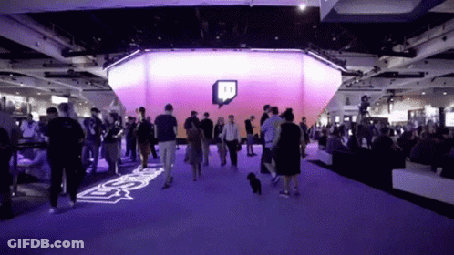 Crowd Gathered In Room With Twitch Logo GIF