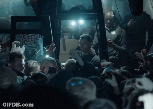 Crowd Gathering In Dark Room Cheer Sign GIF