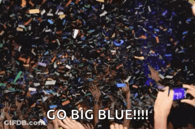Crowd Holding Hands Up With Confetti GIF