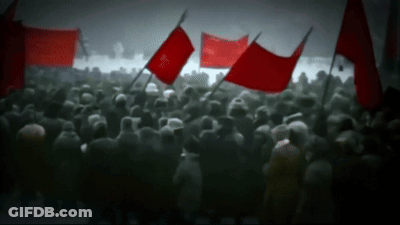Crowd Holding Red Flags Including Freedom GIF