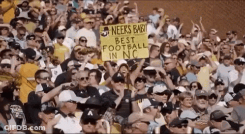 Crowd Holding Sign Saying Neers Baby GIF