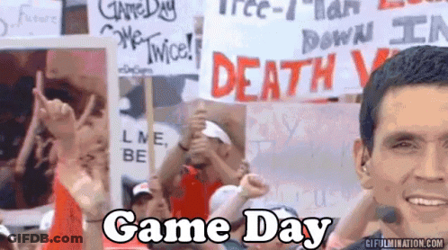 Crowd Holding Signs Saying Game Day GIF