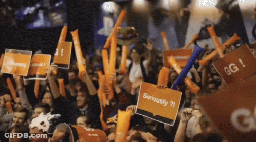 Crowd Holding Signs Saying Seriously GIF