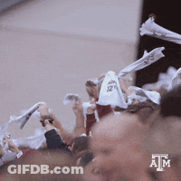 Crowd Holding White Shirts With ATM GIF