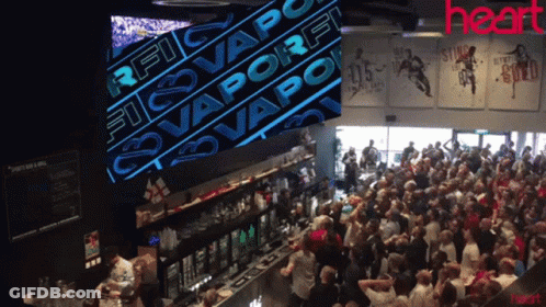 Crowd In Bar With Rfc Vaporfi Sign GIF