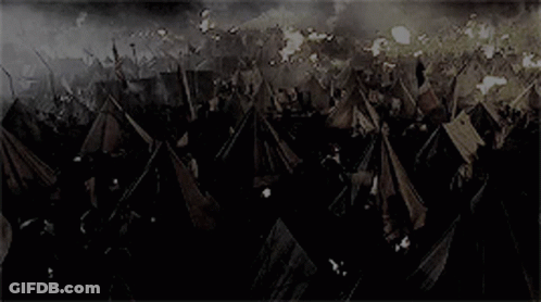 Crowd In Field With Tents And Flags GIF