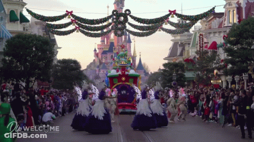 Crowd In Front Of Castle And Do Welcome Sign GIF