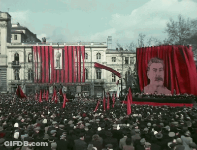 Crowd In Front Of Red Curtain With Man GIF