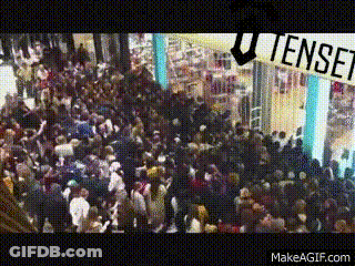 Crowd In Mall Under Tense Sign GIF