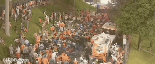 Crowd In Park Near Emergency Bus GIF