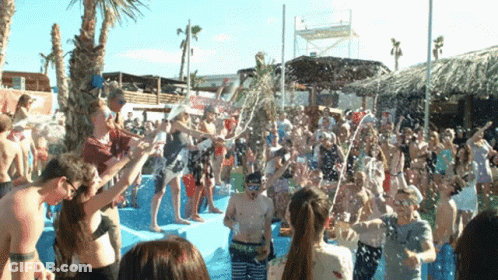 Crowd In Pool With Water Bottles Pouring GIF