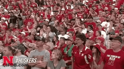 Crowd In Red Shirts Sitting In Stadium GIF
