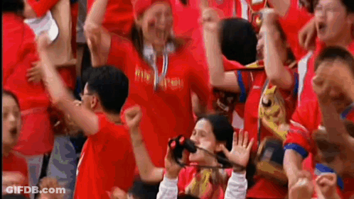 Crowd In Red Shirts Watching Soccer Game GIF