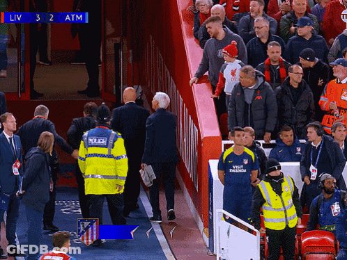 Crowd In Stadium With Scoreboard Showing Liv 3 To 2 Atm GIF
