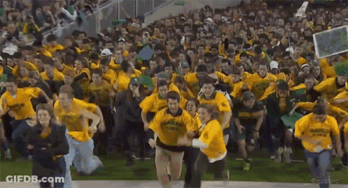 Crowd In Yellow Shirts Cheering Running On Field GIF