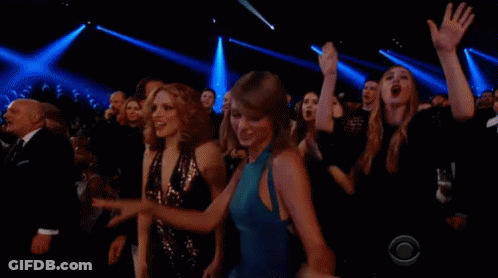 Crowd Of People With Hands In The Air GIF