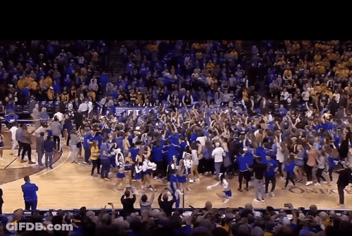 Crowd On Basketball Court With TCU Banner GIF