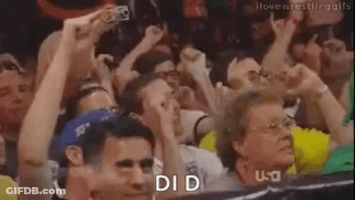 Crowd Raising Hands Watching Wrestling Match GIF
