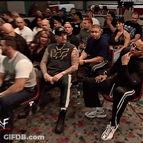 Crowd Sitting With Man In Uf Shirt GIF