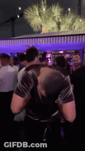 Crowd Under Purple Umbrella GIF