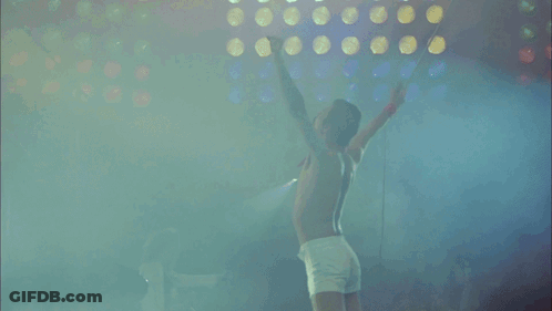 Crowd Watching Band On Stage Oasis Sign GIF