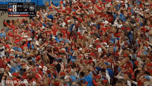 Crowd Watching Baseball Game With Independence Scoreboard GIF