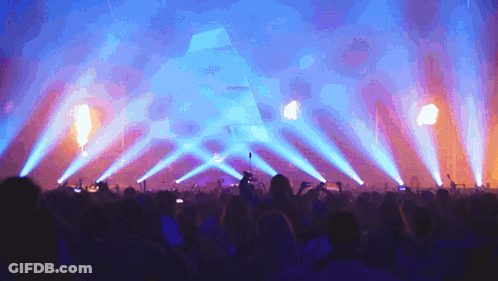 Crowd Watching Concert With Blue Lights GIF