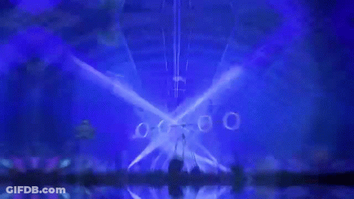 Crowd Watching Concert With Blue Lights GIF