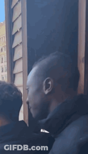 Crowd Watching Football Game As Santa Takes Picture GIF
