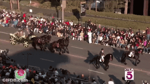 Crowd Watching Parade With KTLA 5 Sign GIF