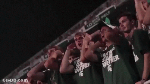 Crowd Wearing Green Shirts Saying Stand Together GIF