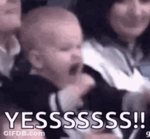 Crying Baby Held By Woman In Crowd GIF
