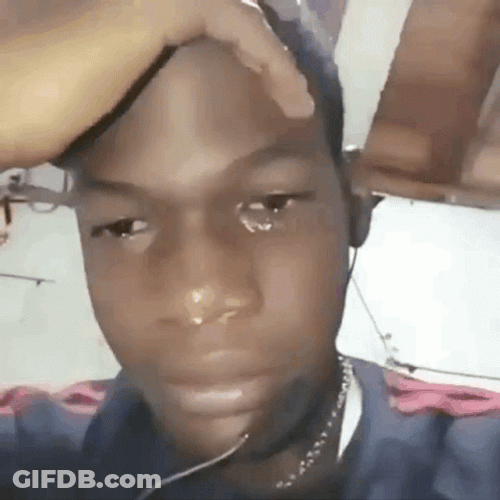 Crying Guy Holding Back His Sobbing GIF