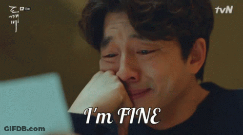 Crying Man Holding Paper Saying I'm Fine GIF