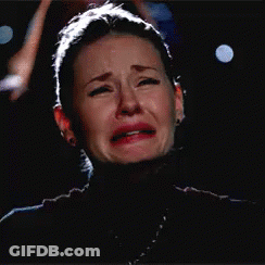 Crying Woman Eating Sandwich With Eyes Closed GIF