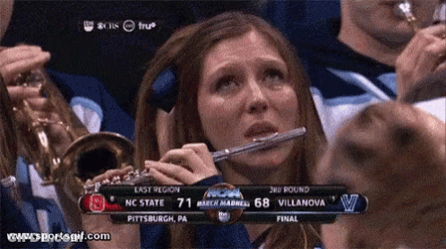 Crying Woman Playing Flute Scoreboard GIF