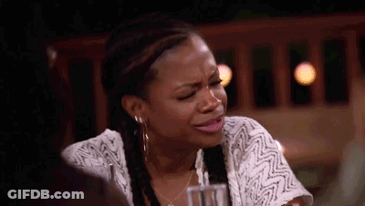 Crying Woman Sitting At Table With Drink GIF