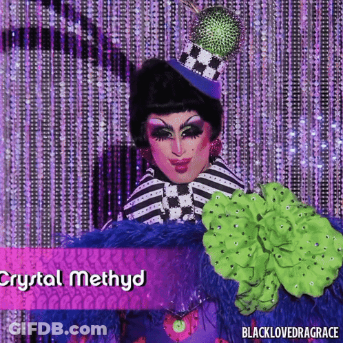 Crystal Methyd Drag Queen In Striped Outfit And Top Hat GIF