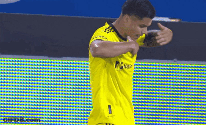 Cucho Hernandez Brushing Off His Shirt GIF