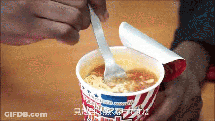 Cup Of American Noodle Soup With Spoon GIF