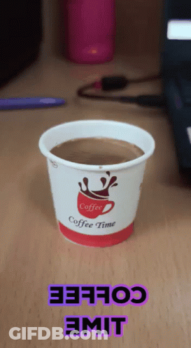 Cup Of Coffee On Wooden Table GIF