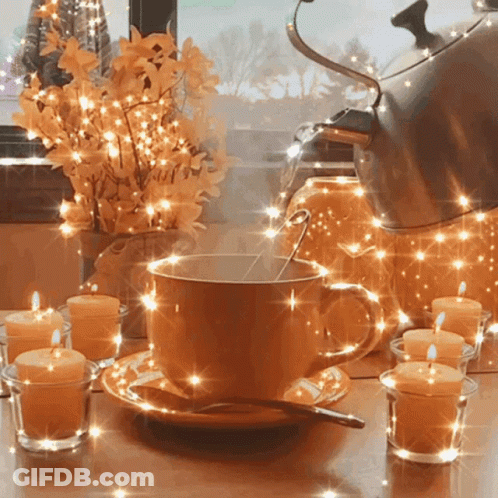 Cup Of Coffee With Spoon And Candles GIF