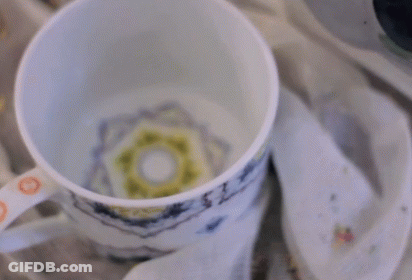 Cup Of Hot Chocolate Poured Into Napkin GIF