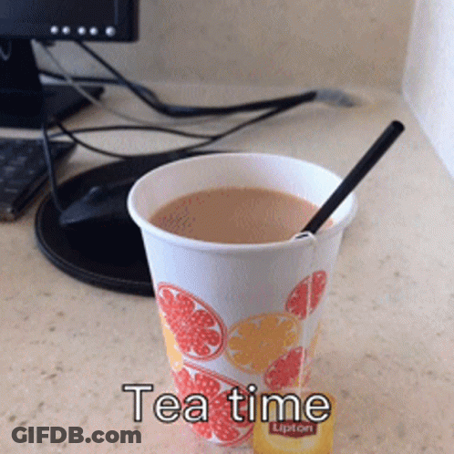 Cup Of Lipton Tea Next To Computer Monitor GIF