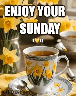 Cup Of Tea Next To Yellow Flowers GIF